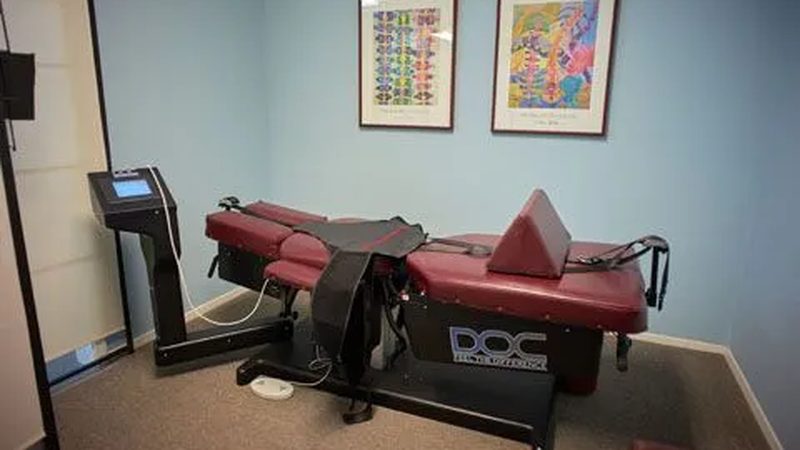 A spinal decompression therapy table in a treatment room